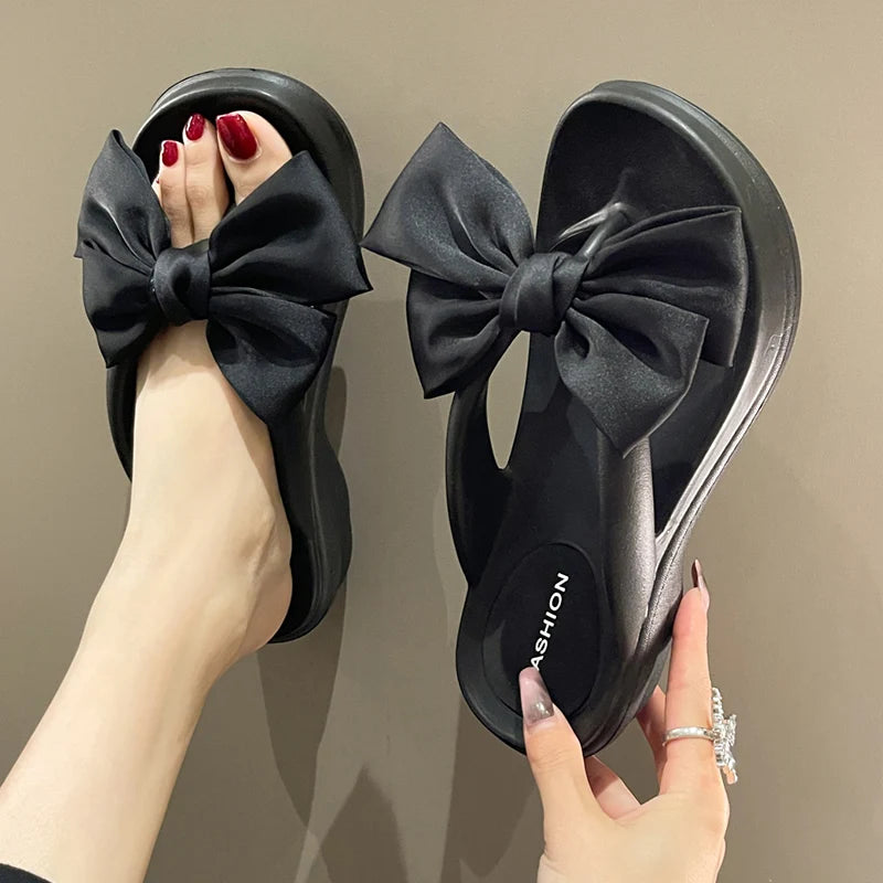 claquette noeud papillon vue de face noir 